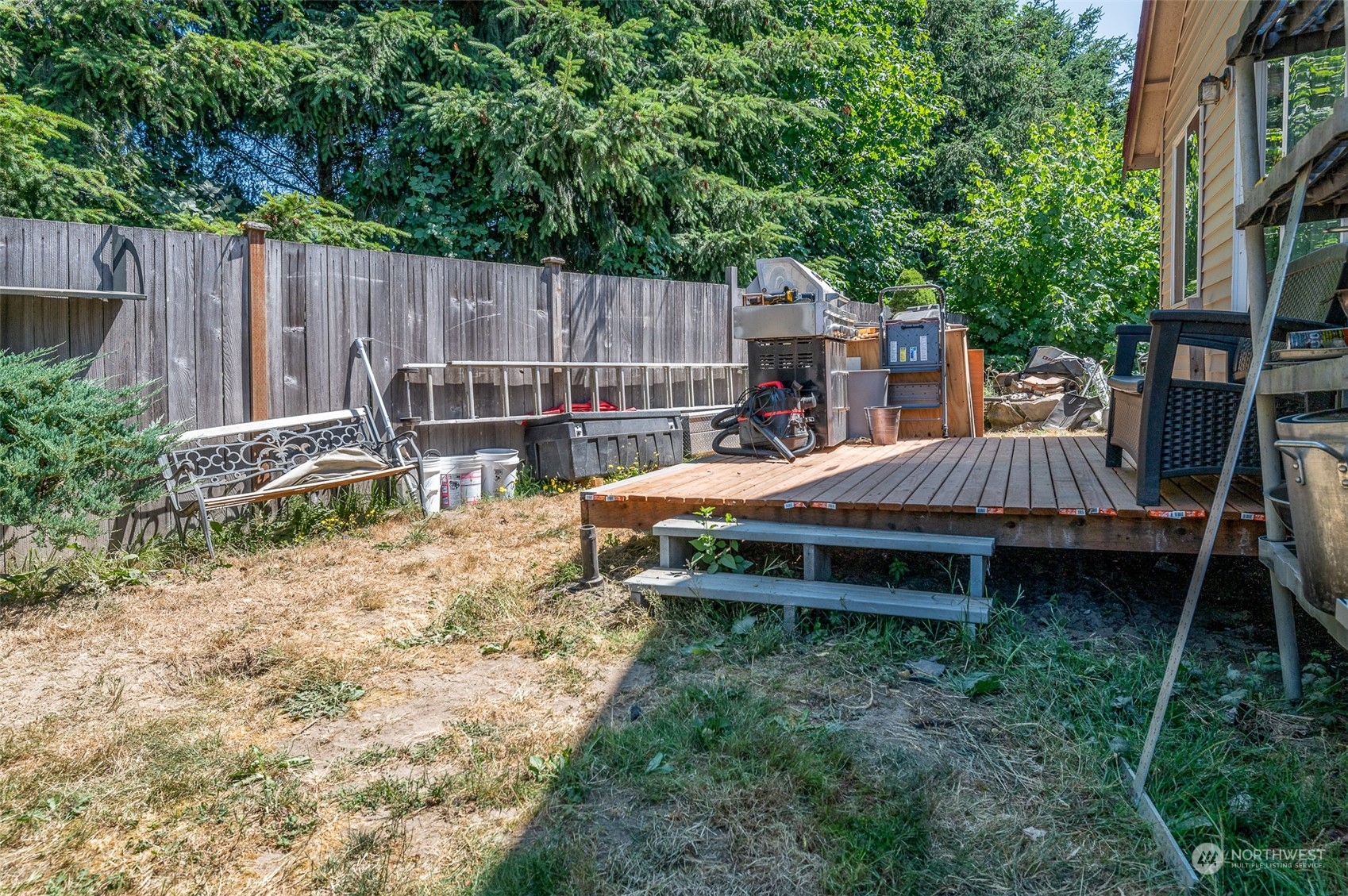 403 Rohrer Loop Sedro-Woolley, WA 98284 - Photo 17 of 24 a backyard of a house with table and chairs