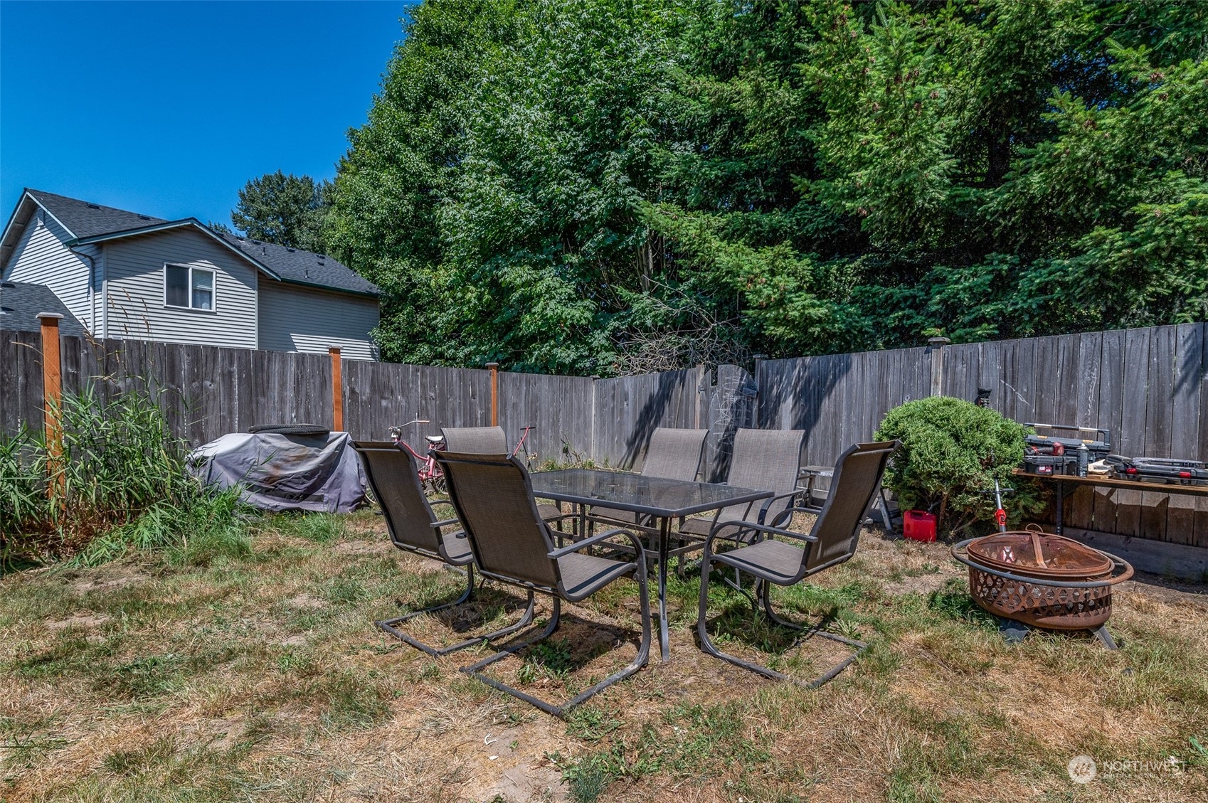 403 Rohrer Loop Sedro-Woolley, WA 98284 - Photo 19 of 24 a view of a chairs and table in backyard