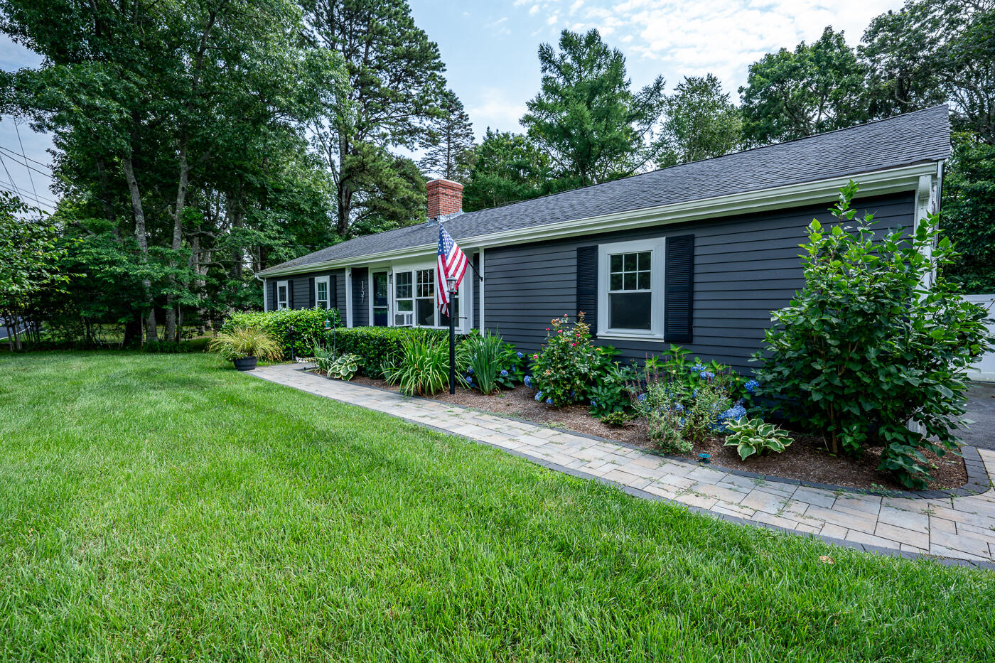 157 Lumbert Mill Road Centerville, MA 02632 - Photo 1 of 42 a view of backyard with potted plants and large tree