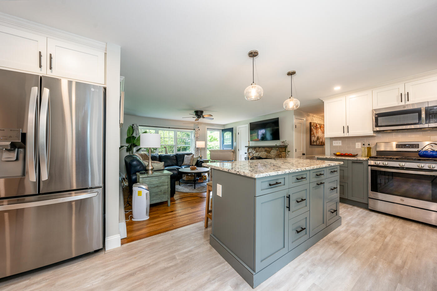 157 Lumbert Mill Road Centerville, MA 02632 - Photo 12 of 42 a kitchen with stainless steel appliances granite countertop a refrigerator a stove a sink and a refrigerator