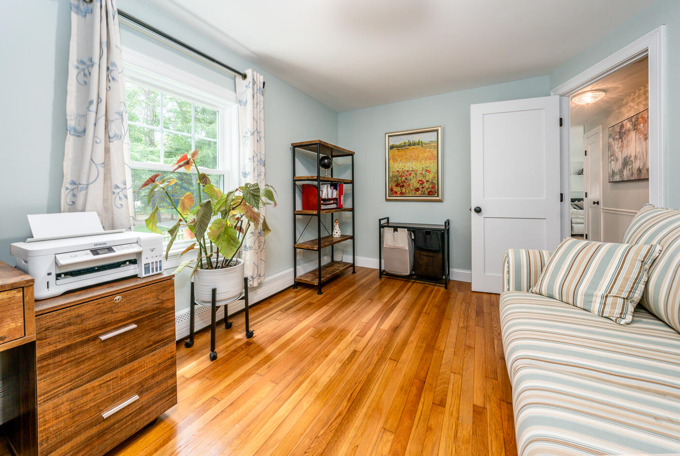 157 Lumbert Mill Road Centerville, MA 02632 - Photo 22 of 42 a living room with furniture and a wooden floor