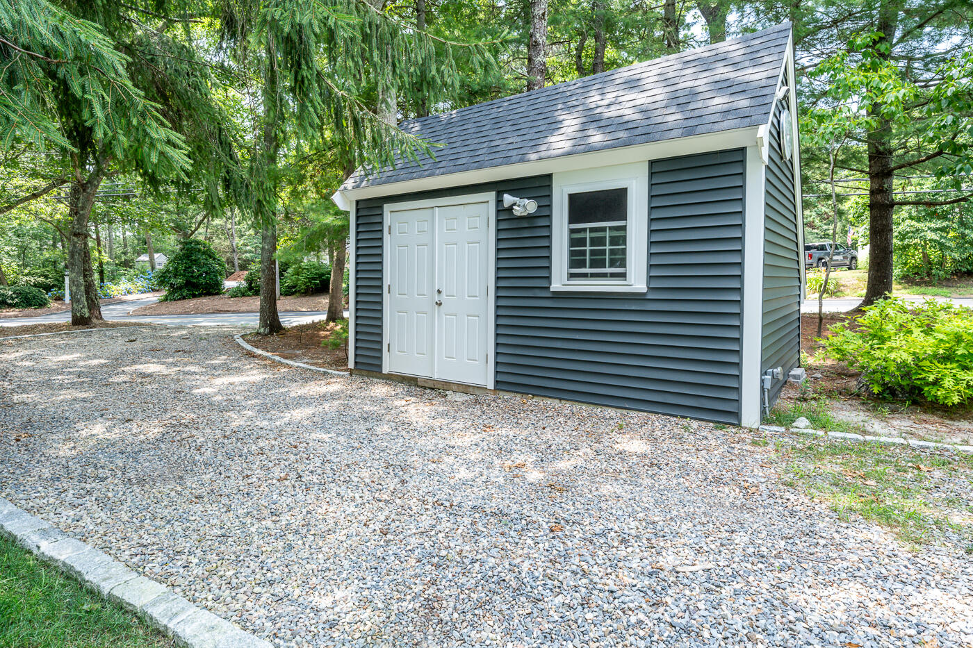 157 Lumbert Mill Road Centerville, MA 02632 - Photo 32 of 42 a house with trees in the background