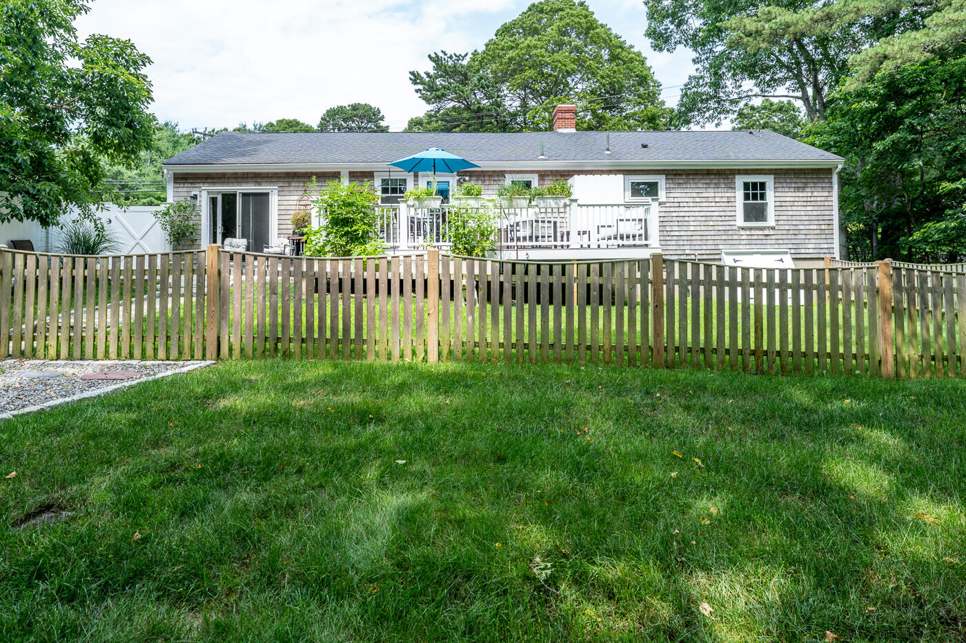 157 Lumbert Mill Road Centerville, MA 02632 - Photo 36 of 42 a front view of a house with a garden