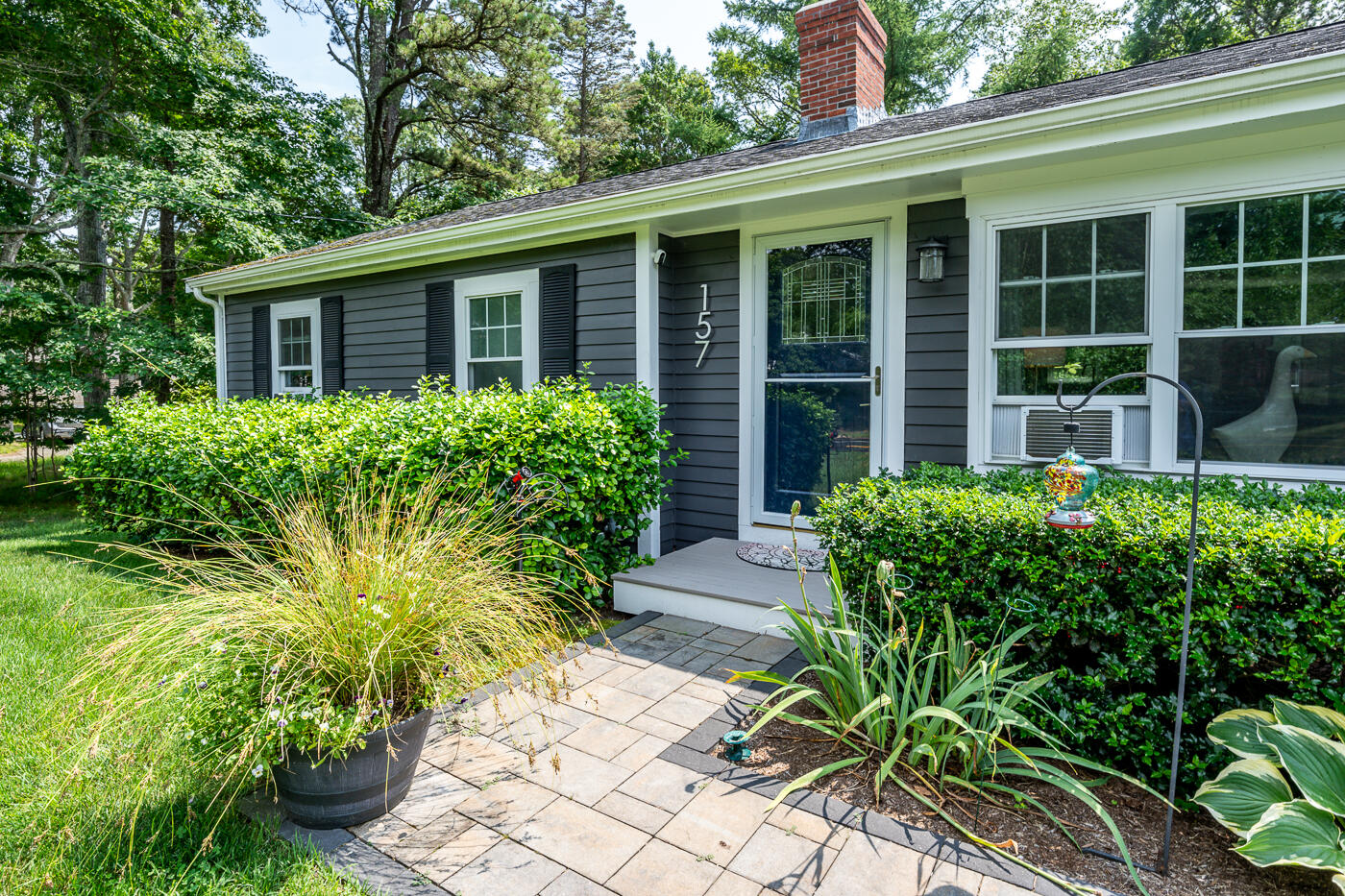 157 Lumbert Mill Road Centerville, MA 02632 - Photo 37 of 42 a front view of a house with garden