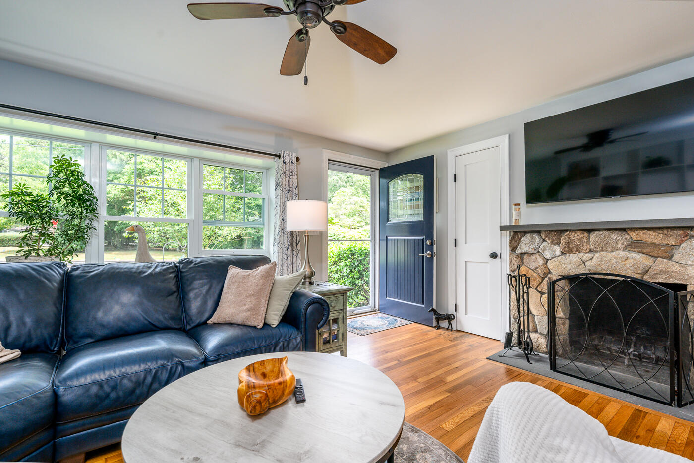 157 Lumbert Mill Road Centerville, MA 02632 - Photo 5 of 42 a living room with furniture and a fireplace