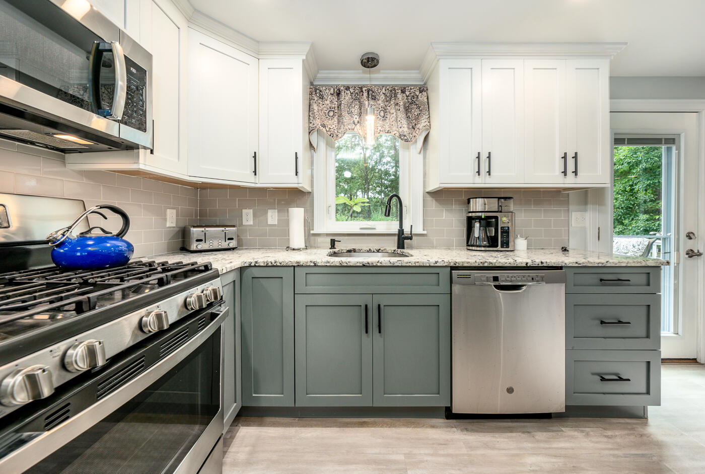 157 Lumbert Mill Road Centerville, MA 02632 - Photo 10 of 42 a kitchen with stainless steel appliances granite countertop a sink stove and cabinets