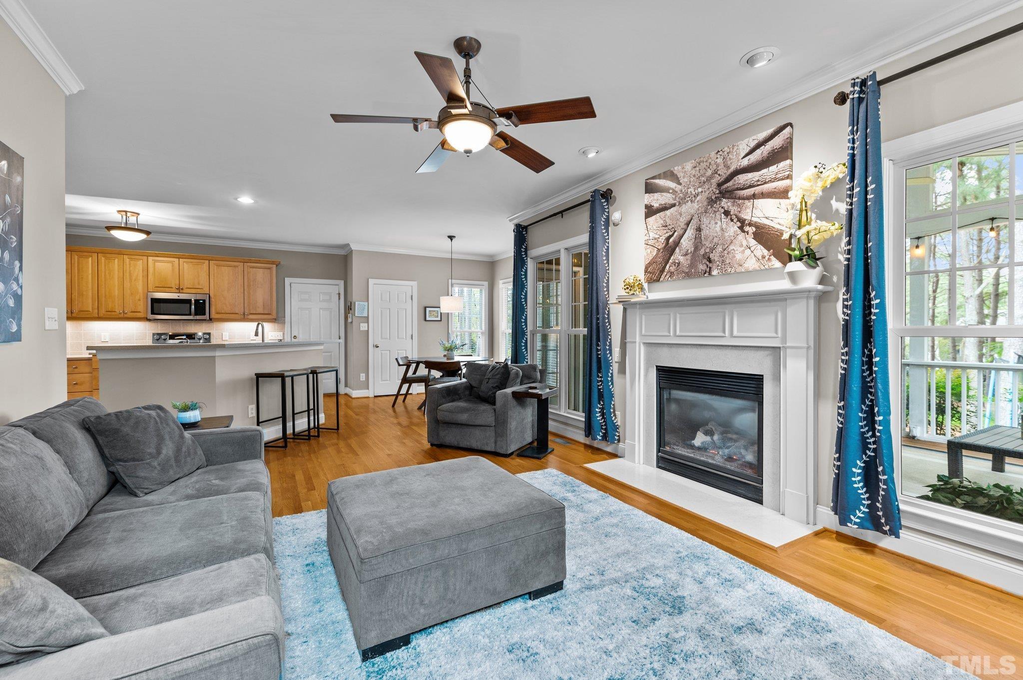1209 Colonial Club Road Wake Forest, NC 27587 - Photo 11 of 28 a living room with furniture and a fireplace