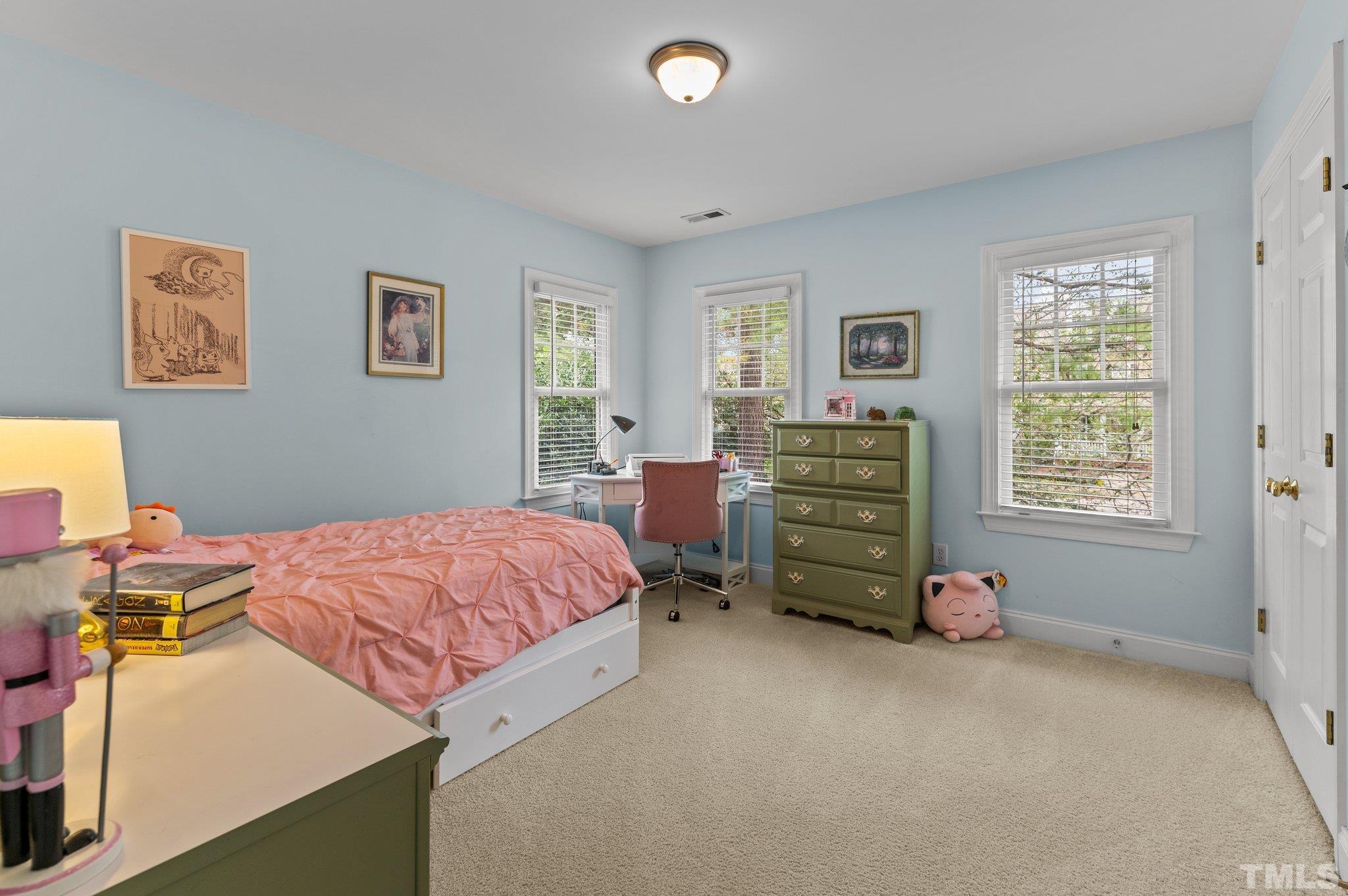 1209 Colonial Club Road Wake Forest, NC 27587 - Photo 14 of 28 a bedroom with a bed and a window