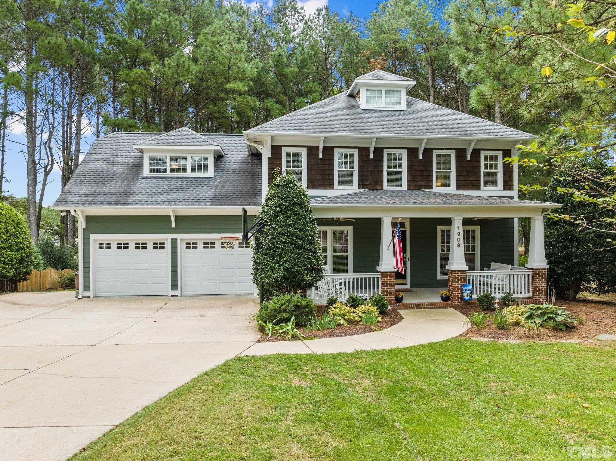 1209 Colonial Club Road Wake Forest, NC 27587 - Photo 2 of 28 a front view of a house with sitting area