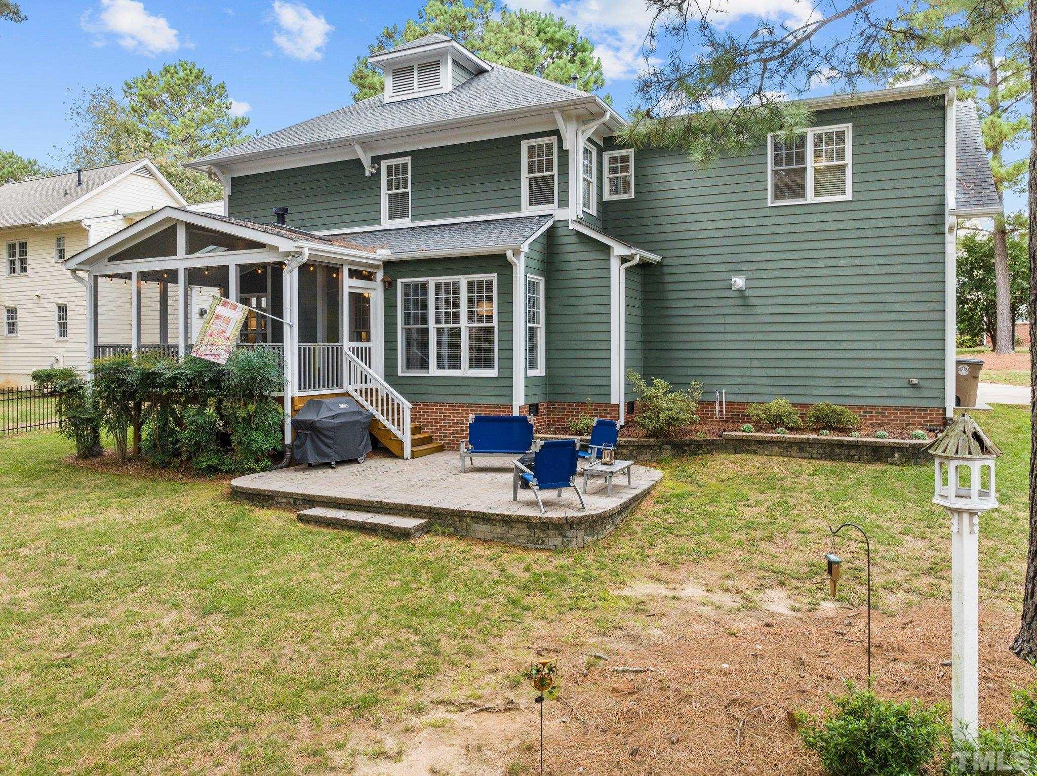 1209 Colonial Club Road Wake Forest, NC 27587 - Photo 22 of 28 a front view of a house with a yard