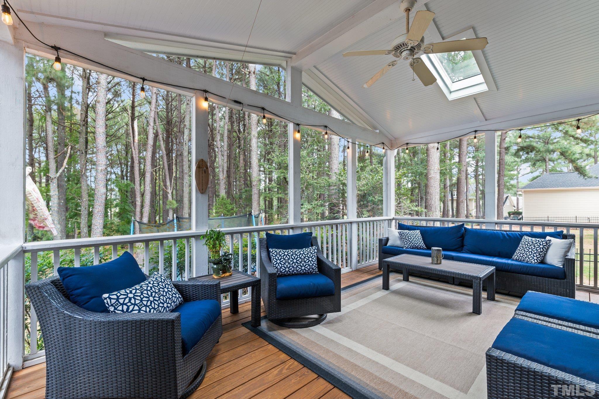 1209 Colonial Club Road Wake Forest, NC 27587 - Photo 24 of 28 a living room with furniture and a floor to ceiling window