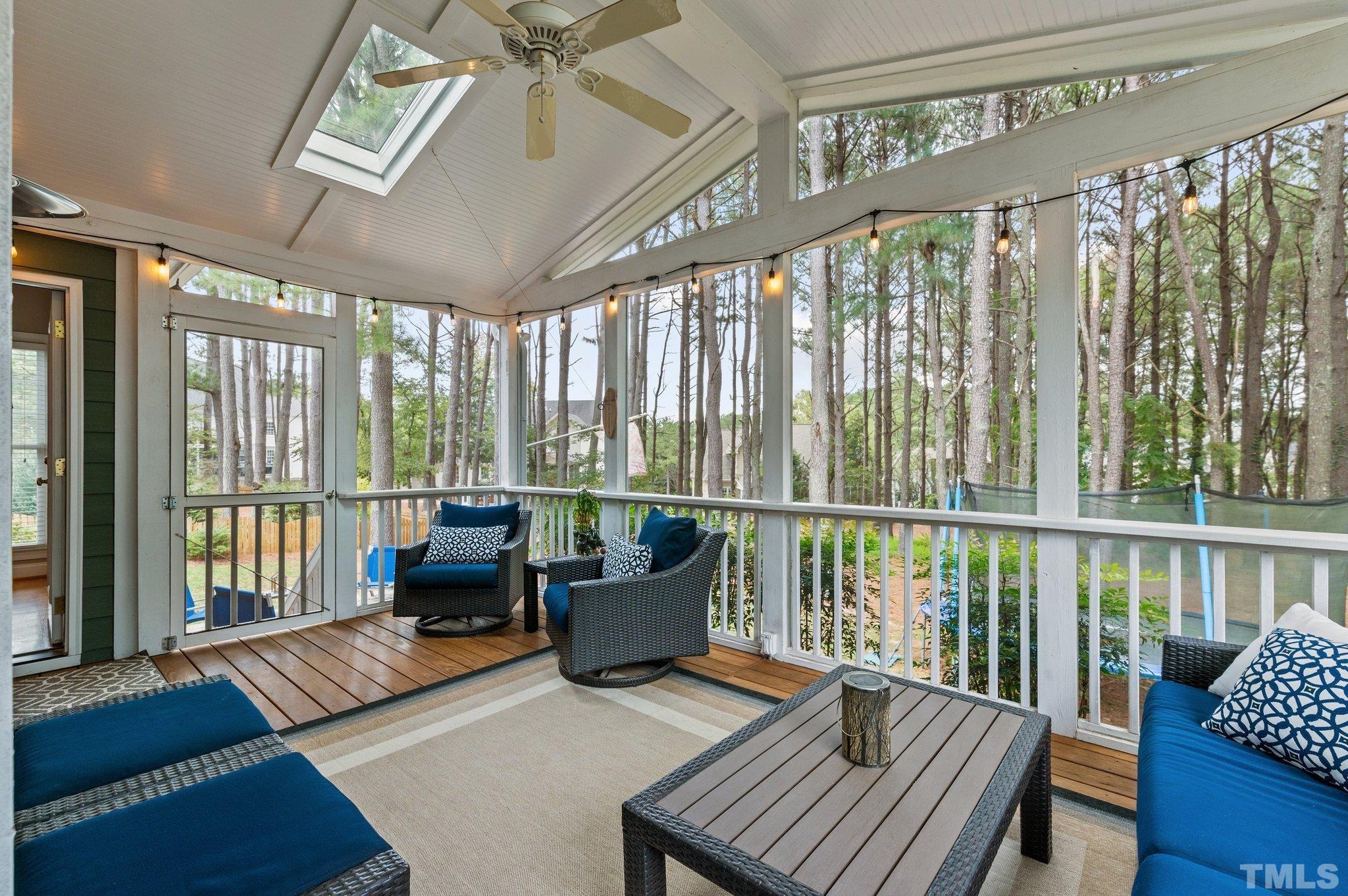 1209 Colonial Club Road Wake Forest, NC 27587 - Photo 25 of 28 a living room with furniture and a floor to ceiling window