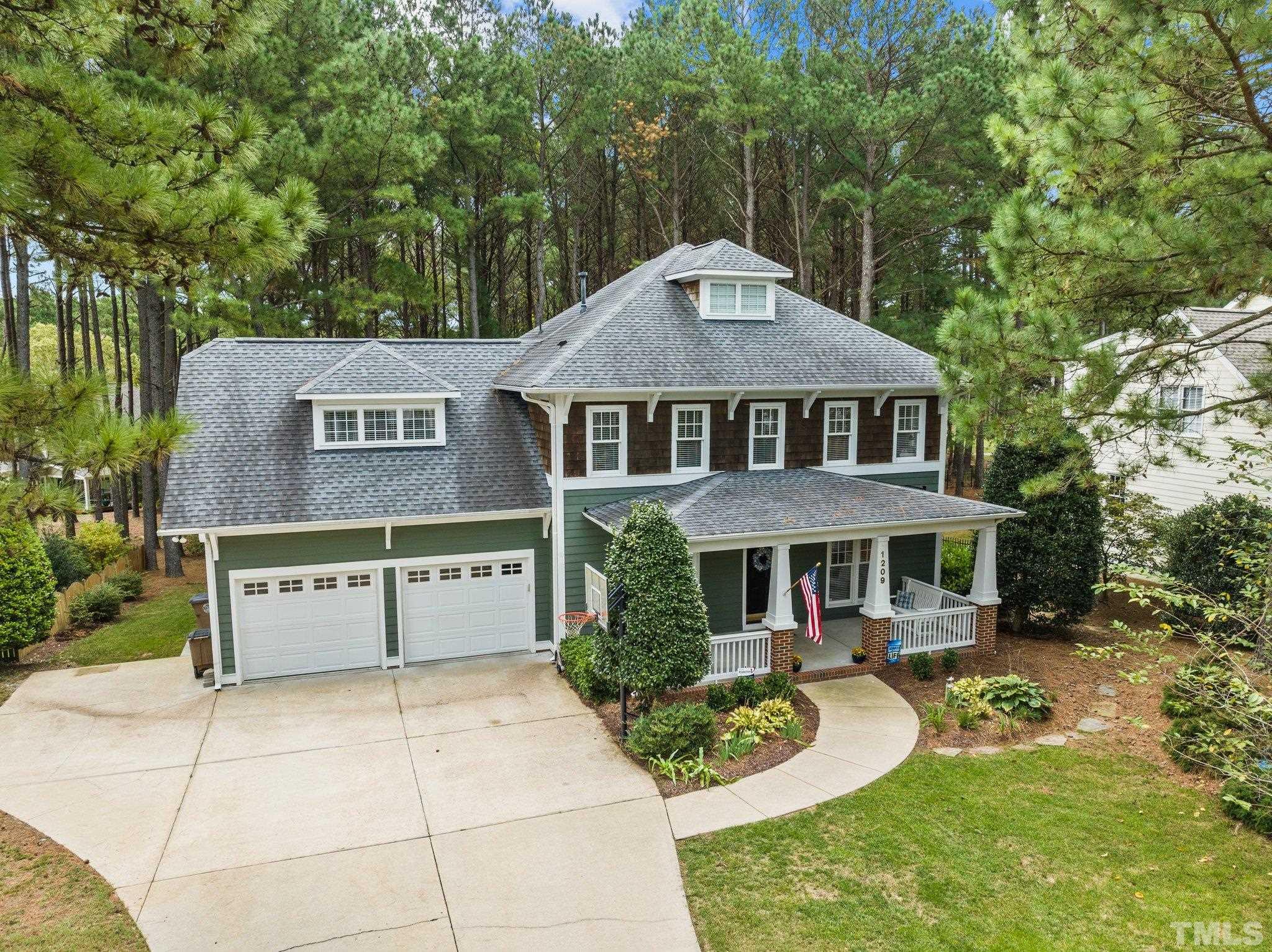 1209 Colonial Club Road Wake Forest, NC 27587 - Photo 28 of 28 a front view of a house with a yard