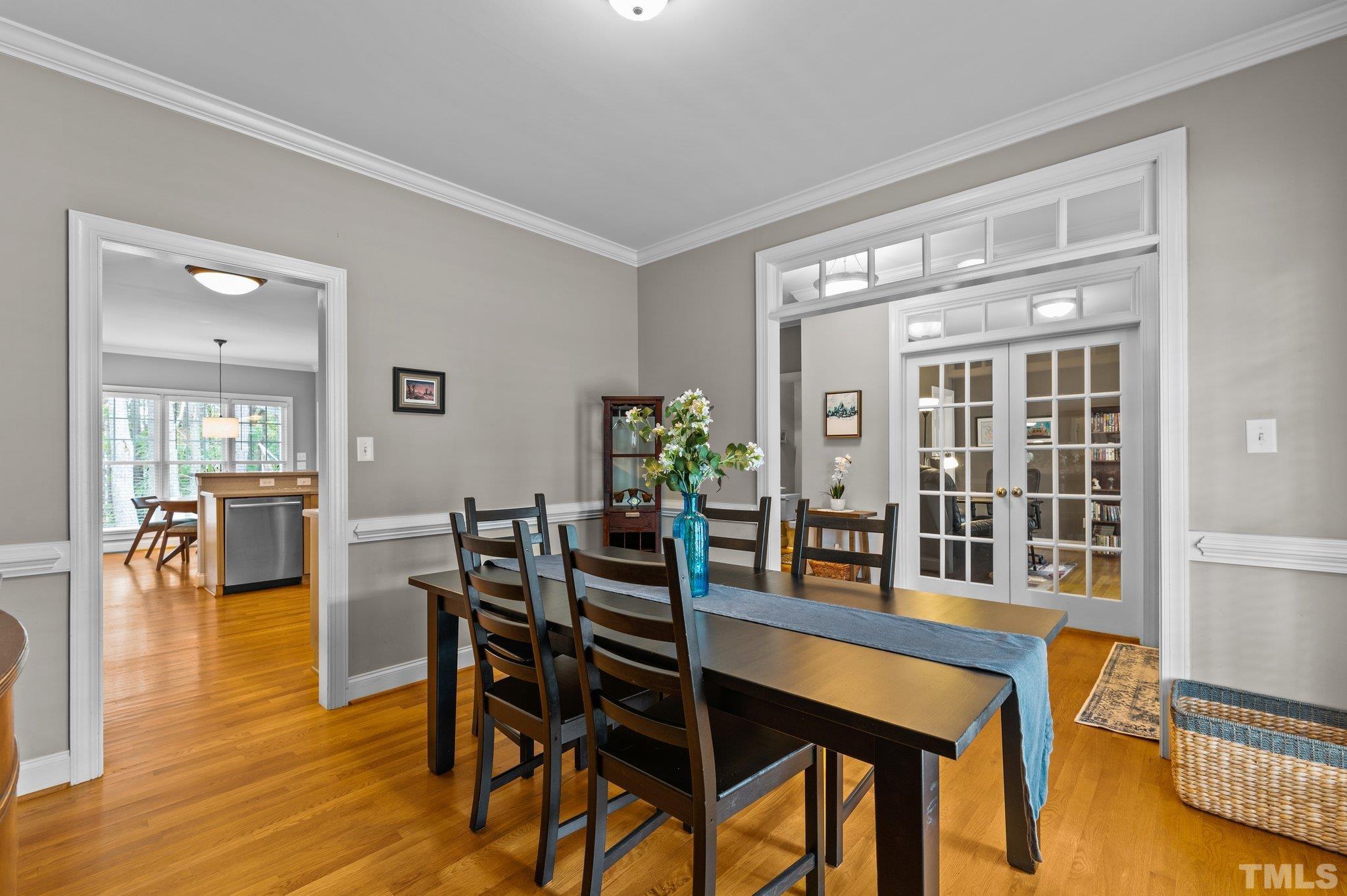 1209 Colonial Club Road Wake Forest, NC 27587 - Photo 5 of 28 a dining room with furniture and wooden floor