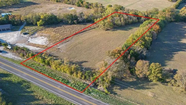 a view of a small yard with wooden bridge
