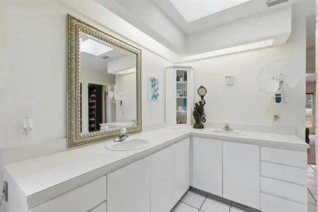 an aerial view of a house with outdoor space pool seating area and yard