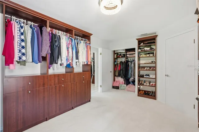 a view of a house with backyard and tree