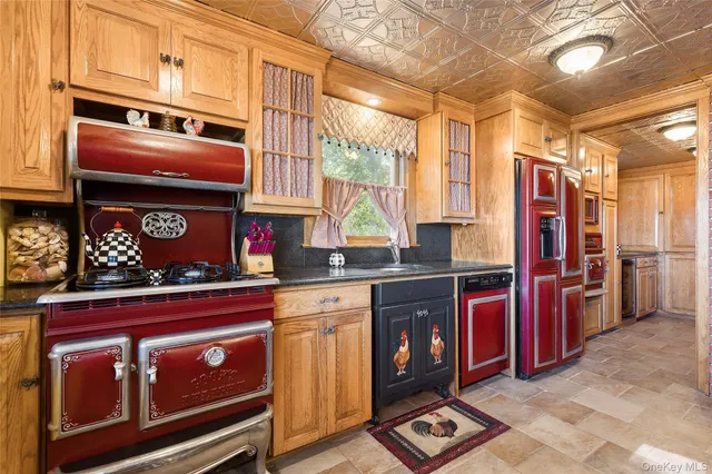 a kitchen with stainless steel appliances granite countertop a stove and cabinets