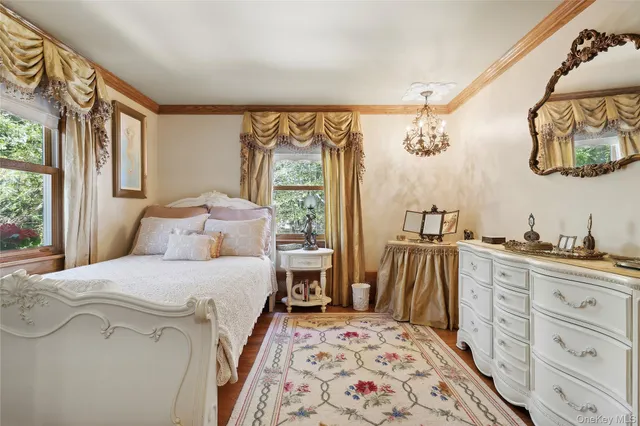 a bedroom with a large bed and a dresser
