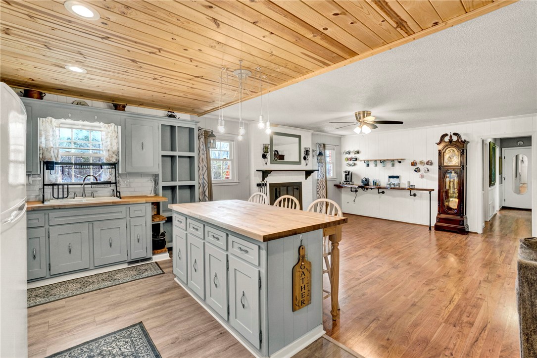 133 Old Liberty Pickens Road Pickens, SC 29671 - Photo 14 of 48 An inviting kitchen with a central island seamlessly transitions into an open living area.