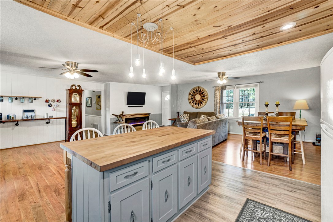 133 Old Liberty Pickens Road Pickens, SC 29671 - Photo 16 of 48 This inviting space features a kitchen island, hardwood flooring, and ample natural light.