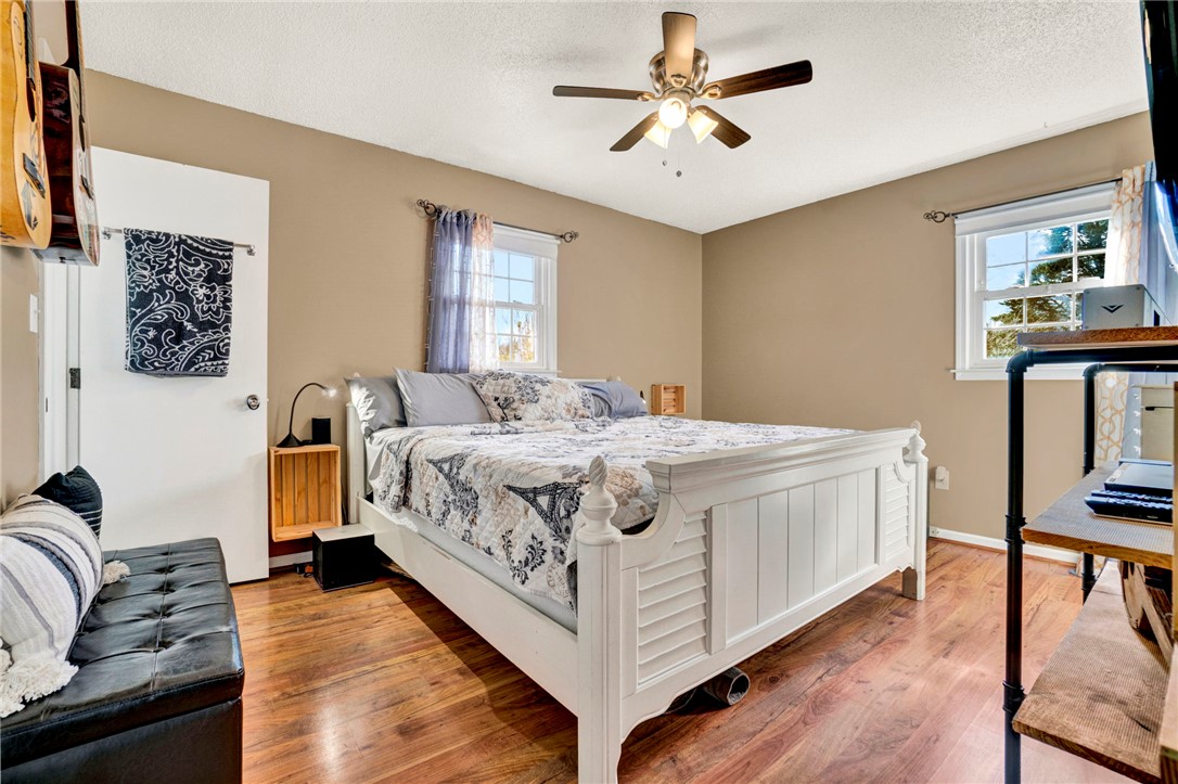 133 Old Liberty Pickens Road Pickens, SC 29671 - Photo 21 of 48 This spacious bedroom offers ample natural light and comfortable wood flooring, creating a relaxing retreat.
