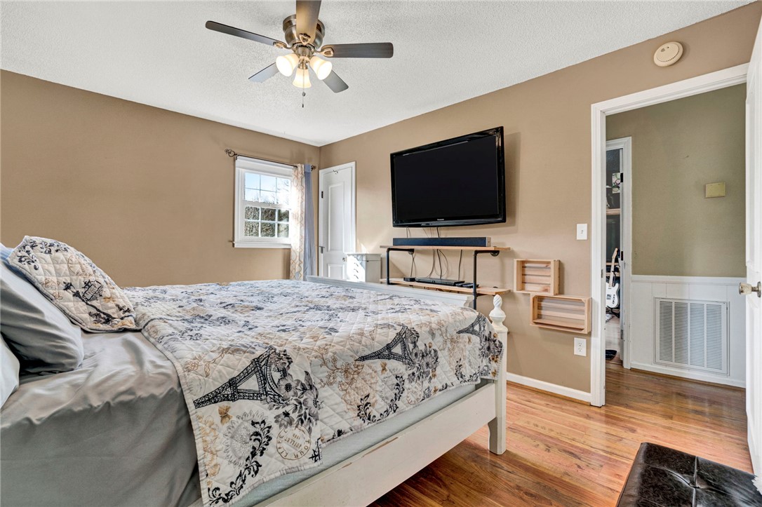 133 Old Liberty Pickens Road Pickens, SC 29671 - Photo 23 of 48 This inviting room features warm wood flooring and a refreshing ceiling fan for ultimate comfort.