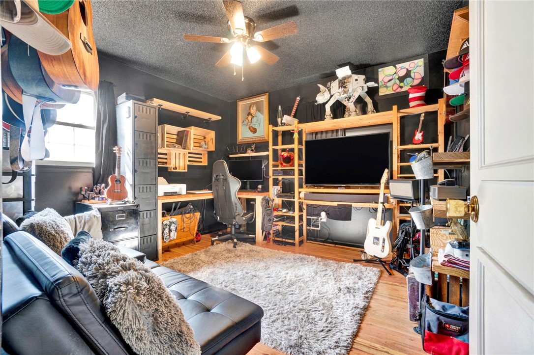 133 Old Liberty Pickens Road Pickens, SC 29671 - Photo 27 of 48 This versatile room features hardwood floors and a ceiling fan, perfect for work or leisure.