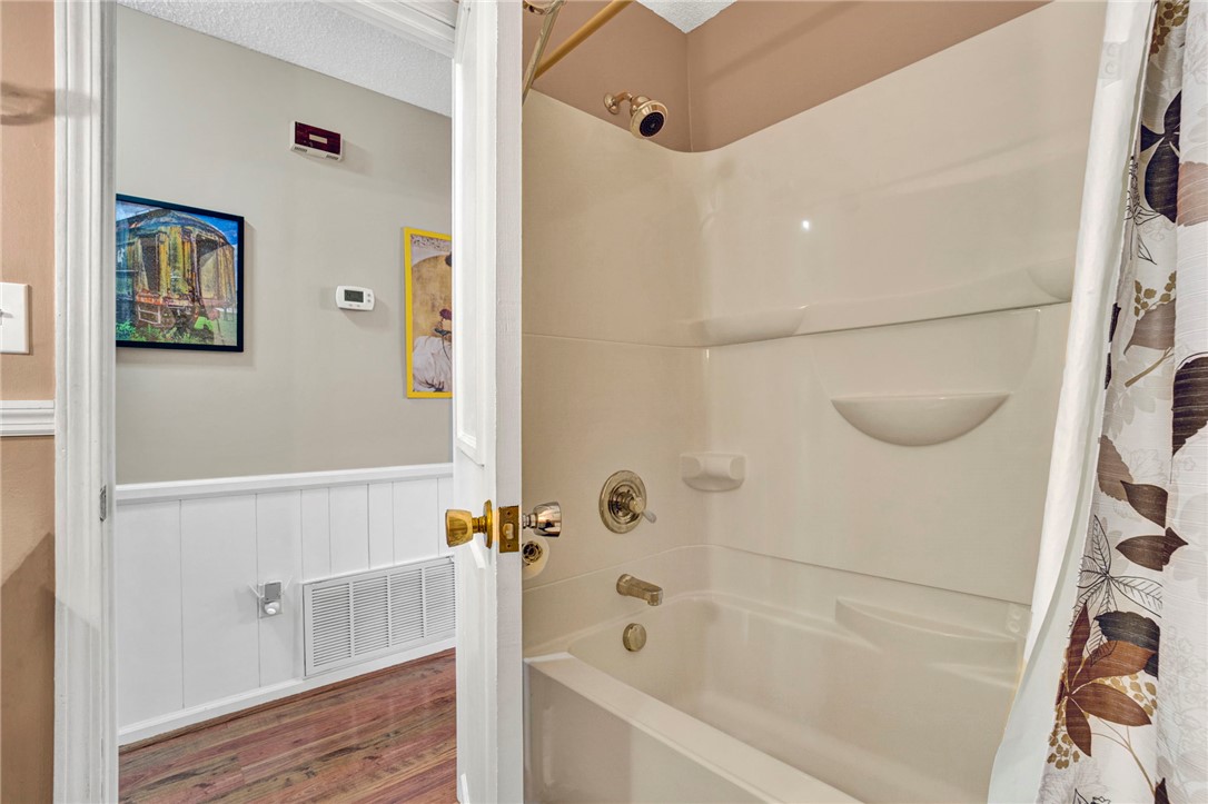 133 Old Liberty Pickens Road Pickens, SC 29671 - Photo 30 of 48 This bright bathroom features a combined shower and tub, offering practical daily convenience.