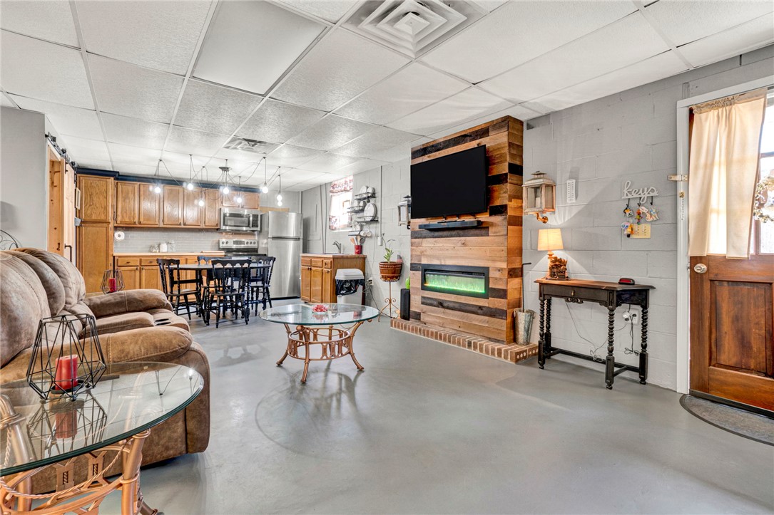 133 Old Liberty Pickens Road Pickens, SC 29671 - Photo 32 of 48 This living space seamlessly blends a cozy kitchen with an inviting entertainment area.