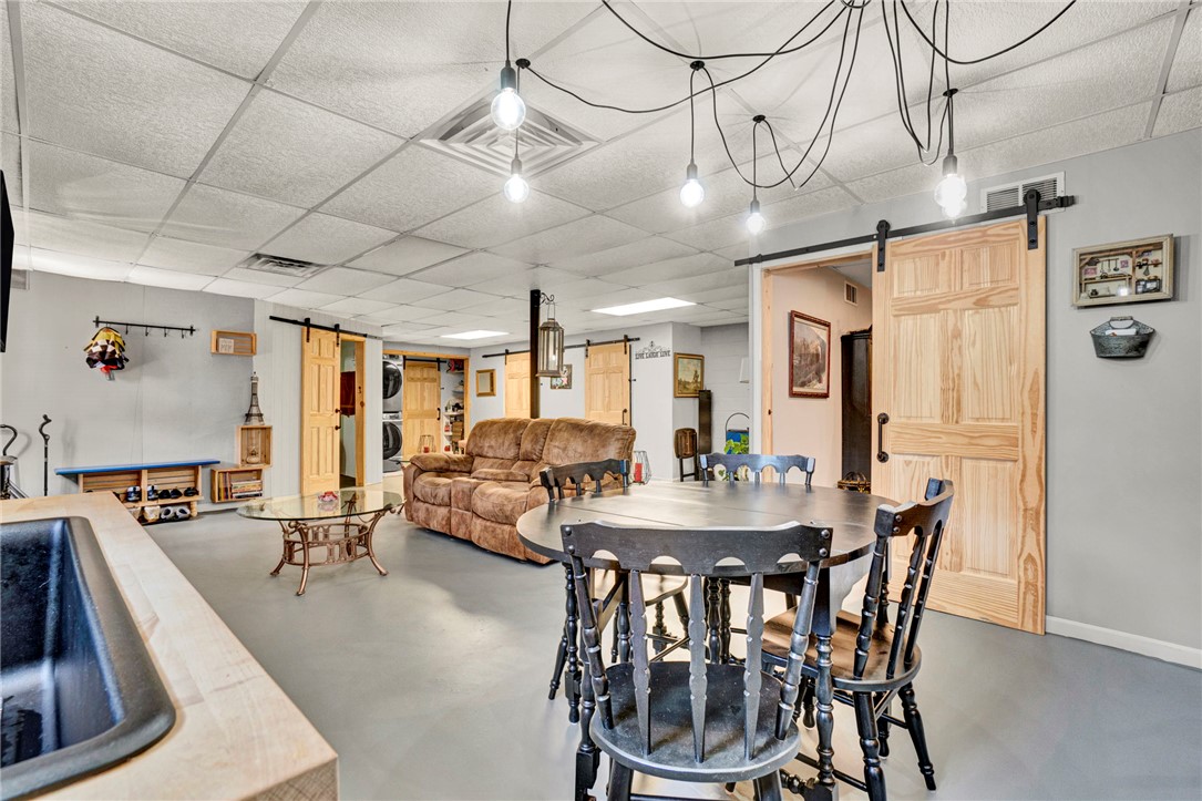 133 Old Liberty Pickens Road Pickens, SC 29671 - Photo 38 of 48 This versatile recreation room features a cozy living area and convenient laundry access.
