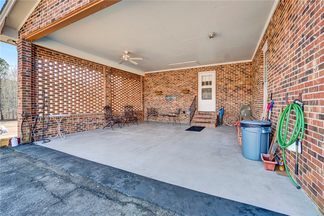 133 Old Liberty Pickens Road Pickens, SC 29671 - Photo 4 of 48 Enjoy outdoor living in this spacious, covered patio area with a brick exterior.