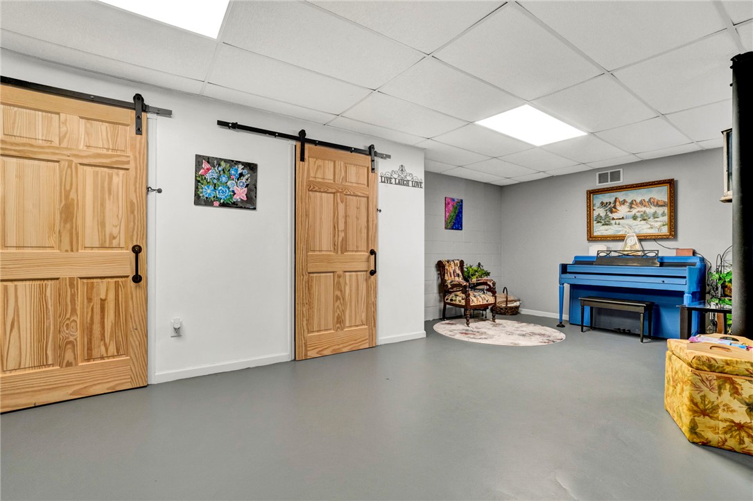 133 Old Liberty Pickens Road Pickens, SC 29671 - Photo 42 of 48 This versatile basement space features stylish barn doors and abundant recessed lighting.