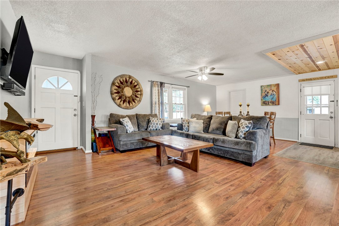 133 Old Liberty Pickens Road Pickens, SC 29671 - Photo 6 of 48 Warm wood floors and ample natural light define this inviting open living space.