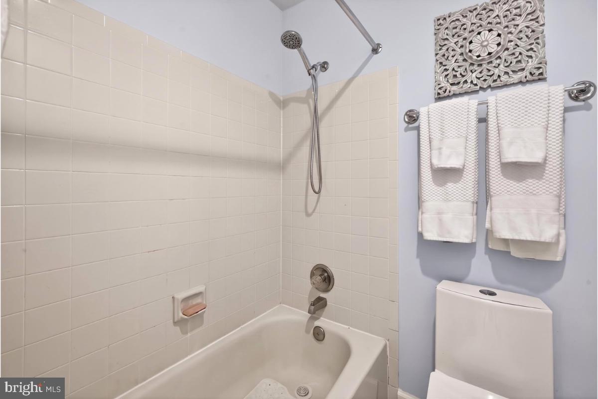 7347 Swan Point Way, Unit 122 Columbia, MD 21045 - Photo 23 of 54 a bathroom with a tub a sink and a shower