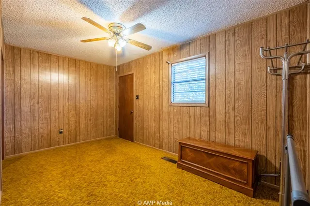 a view of a chairs in a backyard