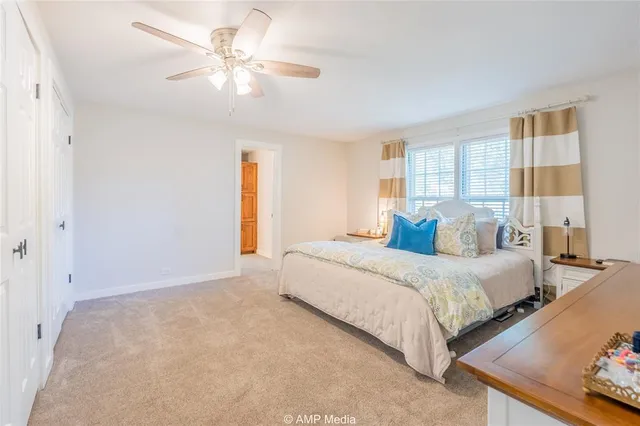 a bedroom with bed and window