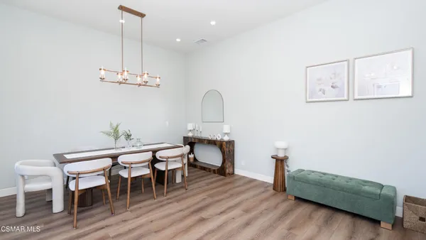 a bathroom with 2 sink and a window