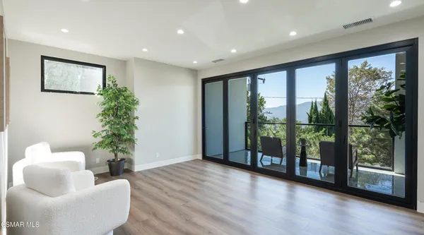 a white bath tub sitting next to a shower
