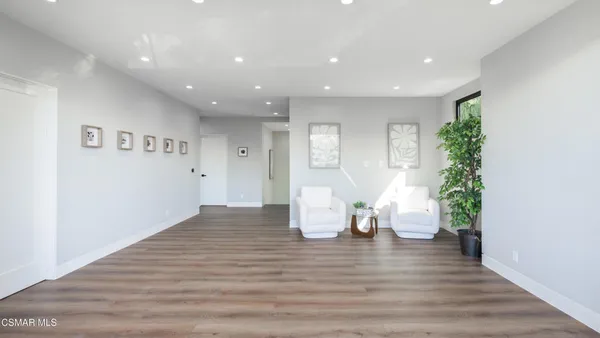 a bedroom with a bed and a mirror