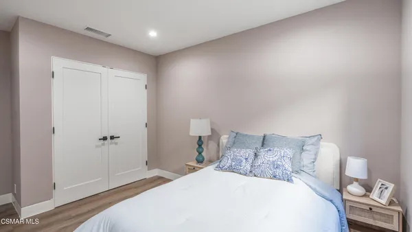 a view of a porch with furniture and a yard