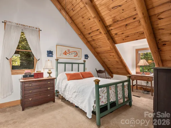 a spacious bathroom with a bathtub and a toilet