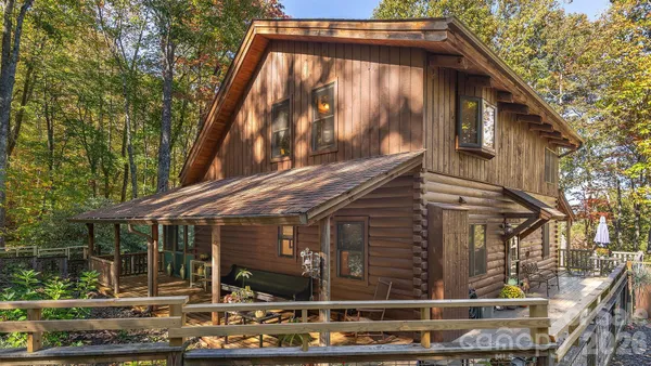 a view of a yard with large trees