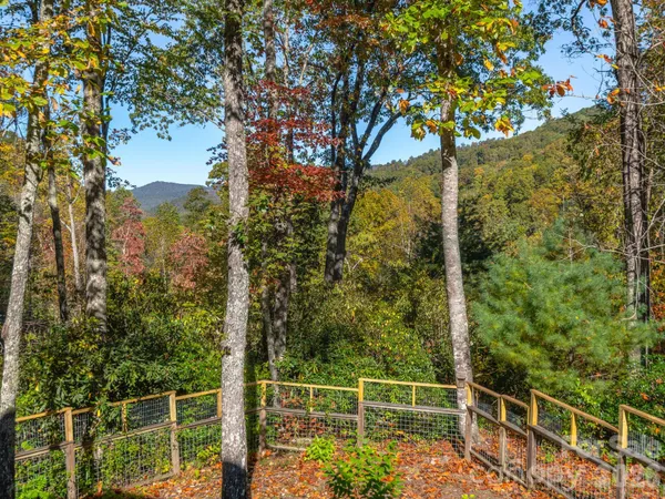 a view of a sitting area with trees in a park