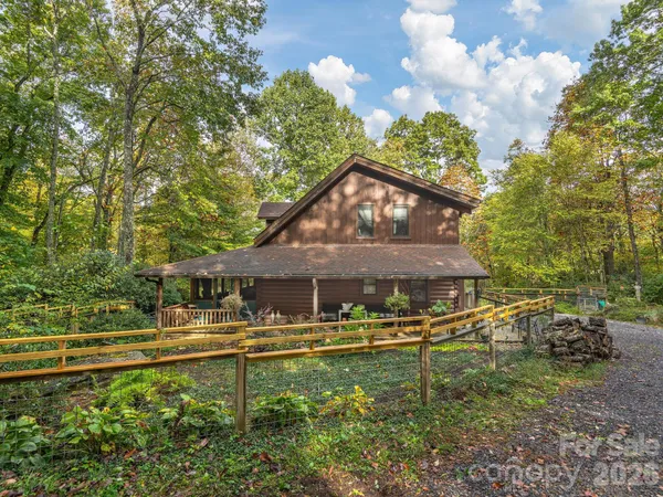 a swimming pool with outdoor seating and yard