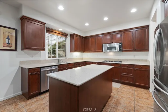 a white toilet sitting next to a bath tub