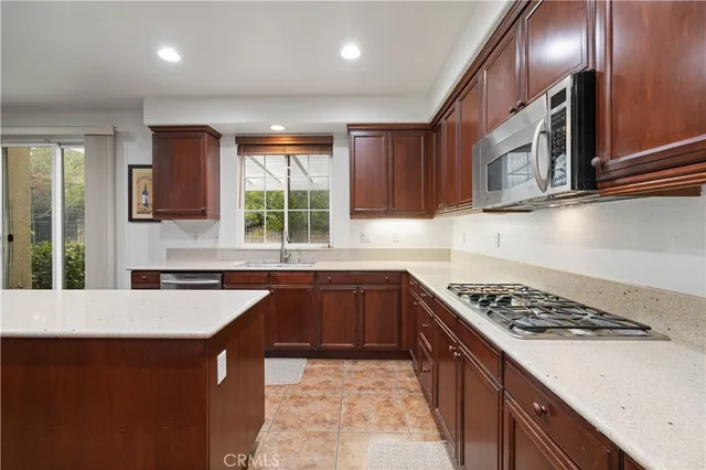 a bedroom with a bed and a television