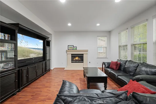 a aerial view of a house with a yard and potted plants