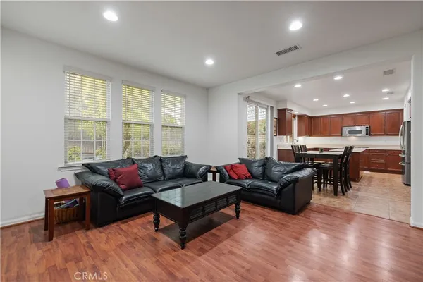 a view of a house with backyard and a patio