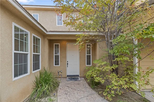 a living room with furniture rug and wooden floor